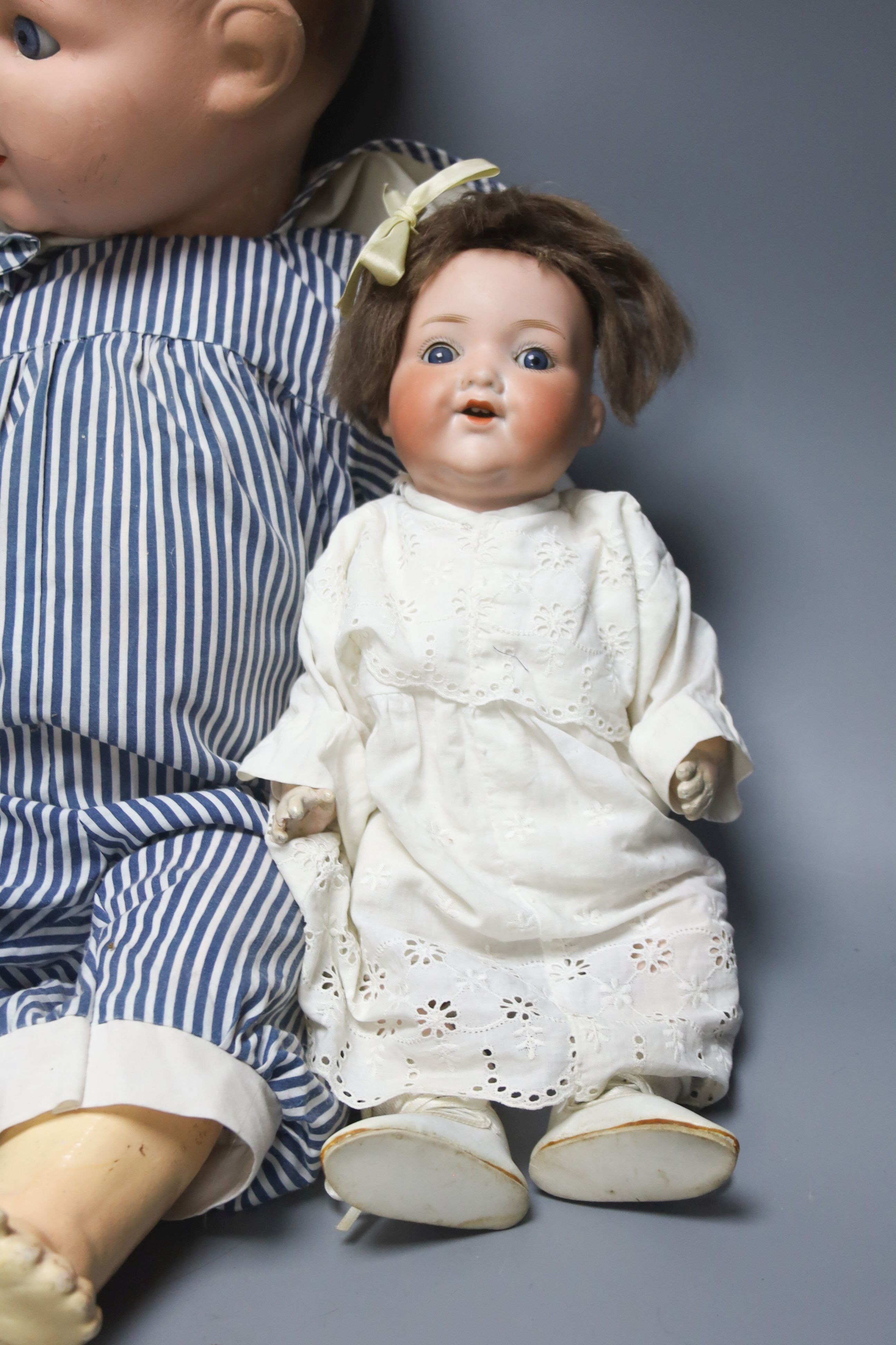 A bent limb AM H.14in. AM baby open mouth H.15in. AM baby painted bisque H23in.